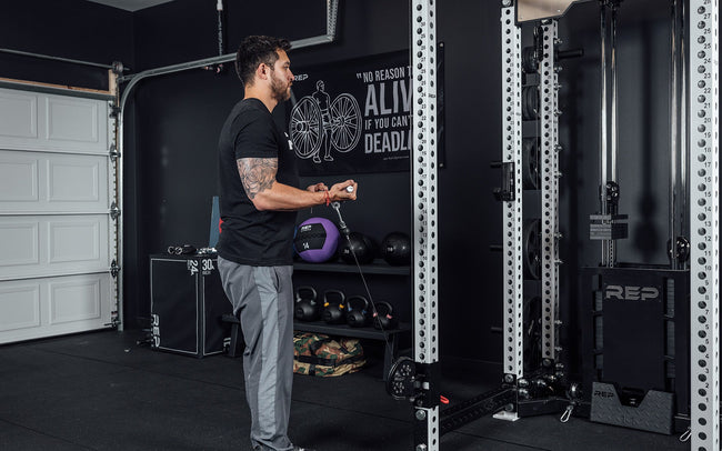 Ares Cable Attachment Being Used With The Straight Bar For Bicep Curls