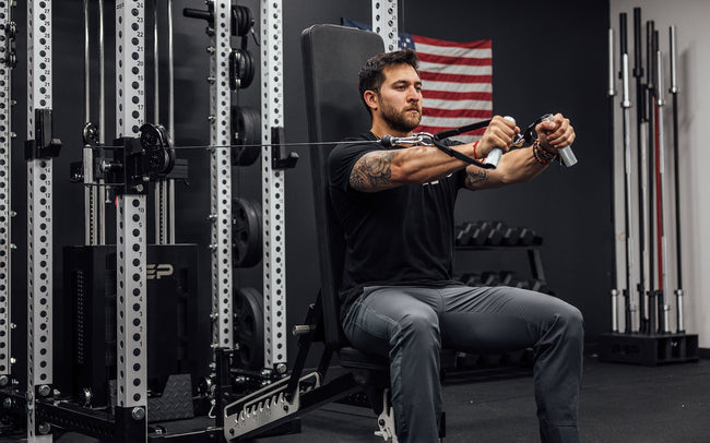 Ares Cable Attachment Being Used With D-handles For Chest Press