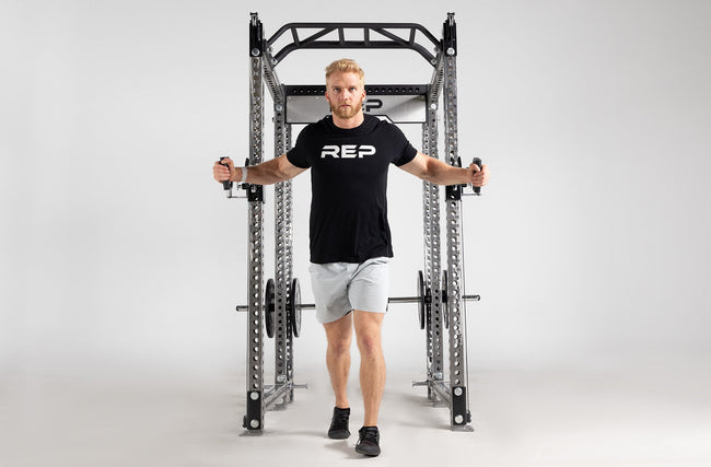 Athena Plate-Loaded Side-Mount Functional Trainer Dual Side Shown on Clear Coat PR-5000 Power Rack Being Used for Chest Flys